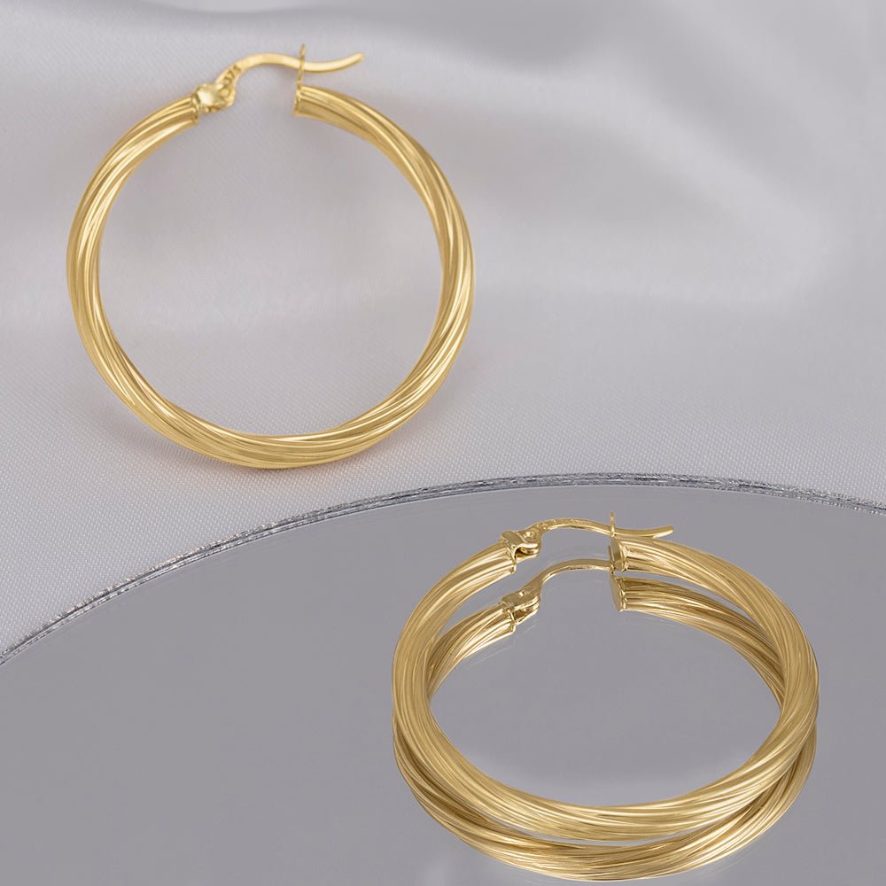 A Jewel with Endless Charm 9 Carat Yellow Gold Earrings Radiating Beauty and Elegance